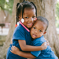 Photo: Brother and Sister Hugging