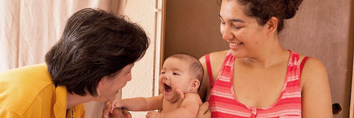 Photo: BCFS Healthy Start Staff Member with a Mother and her Child
